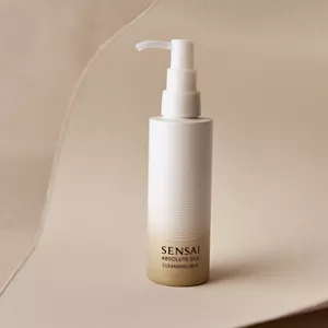 Absolute Silk Cleansing Milk on a neutral beige surface and neutral background